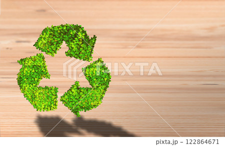 Eco-Friendly Symbolism: Green Recycle Icon on Natural Wooden Background 122864671