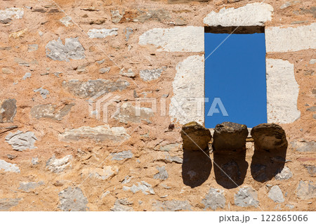 Architecture detail. Old stone wall with window. Architecture detail. Old stone wall with window. 122865066