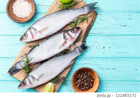 Raw sea bass fish photography . Top view 122865172