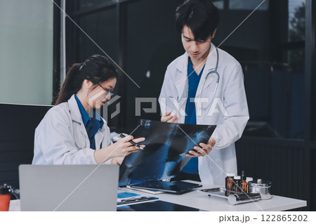 Implement those changes and we can see. Shot of a group of nurses and doctors having a meeting together. 122865202