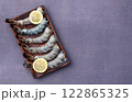 Raw big tiger ( king ) shrimps Cleaned, Peeled & Deveined photography . Top view 122865325