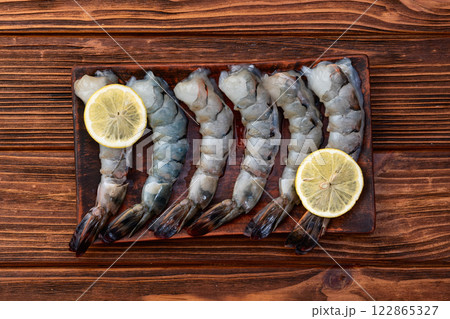 Raw big tiger ( king ) shrimps Cleaned, Peeled & Deveined photography . Top view 122865327