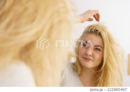 Woman feeling tired in bathroom 122865467