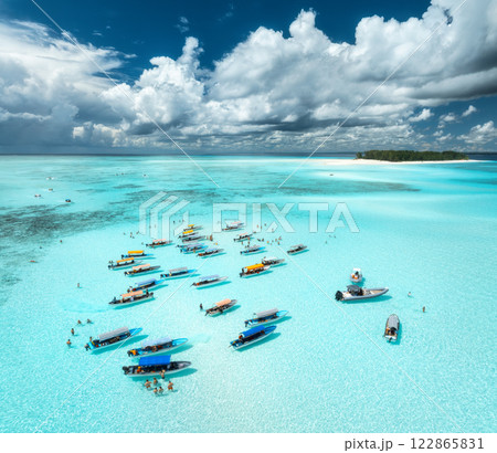 Aerial view of colorful boats and yachts in clear water in summer Aerial view of colorful boats and yachts in clear water in summer 122865831