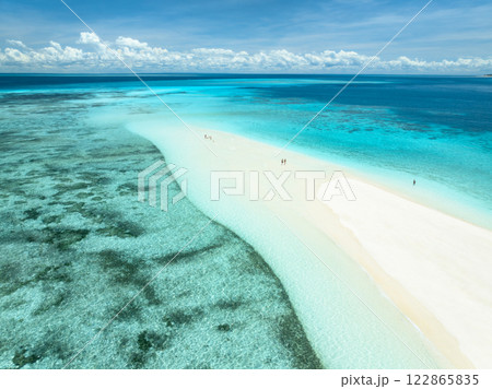 Aerial view of island, sandbank with white sandy beach, blue sea Aerial view of island, sandbank with white sandy beach, blue sea 122865835