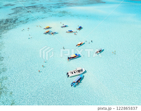 Aerial view of colorful boats, sea with azure water on summer day Aerial view of colorful boats, sea with azure water on summer day 122865837