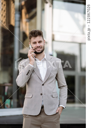 Portrait of a successful business man, confident, looking to camera. Portrait of a successful business man, confident, looking to camera. 122867026