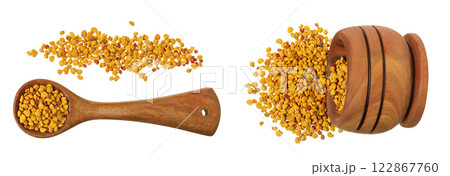 Bee pollen grains in wooden spoon and bowl isolated on white background. Top view. Flat lay 122867760
