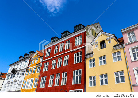 Nyhavn district in Copenhagen, Denmark. City center panoramic view of colorful houses. Nyhavn district in Copenhagen, Denmark. City center panoramic view of colorful houses. 122868308