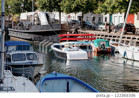 Boat on the Christianshavn canal in Copenhagen. Summer in Denmark. 122868386