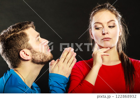 Regretful man husband apologizing woman wife. Regretful man husband apologizing woman wife. 122868932