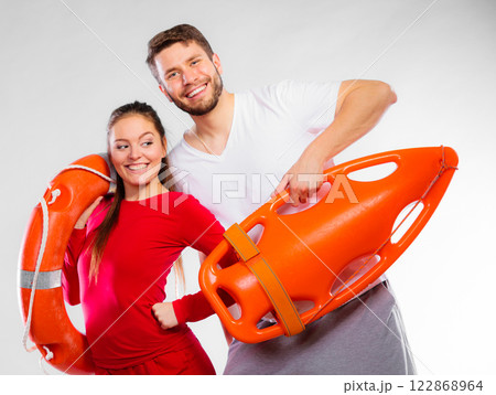 lifeguard couple with rescue equipment lifeguard couple with rescue equipment 122868964