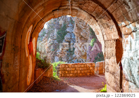 Pedestrian tunnel through a rock or mountain near Petrovac town in winter time, Montenegro Pedestrian tunnel through a rock or mountain near Petrovac town in winter time, Montenegro 122869025