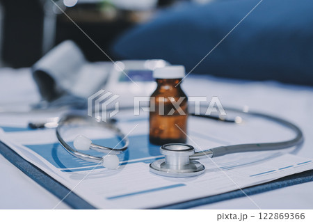 stethoscope on a report stethoscope on a clipboard stethoscope on a book stethoscope on a report stethoscope on a clipboard stethoscope on a book 122869366
