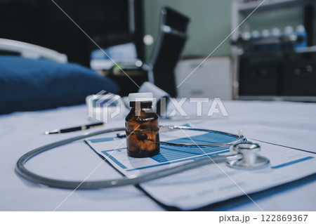 stethoscope on a report stethoscope on a clipboard stethoscope on a book 122869367