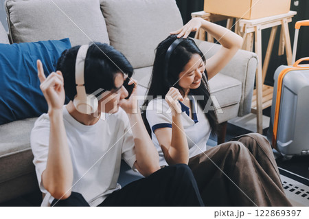 Smiling couple unpacking boxes in new house Smiling couple unpacking boxes in new house 122869397