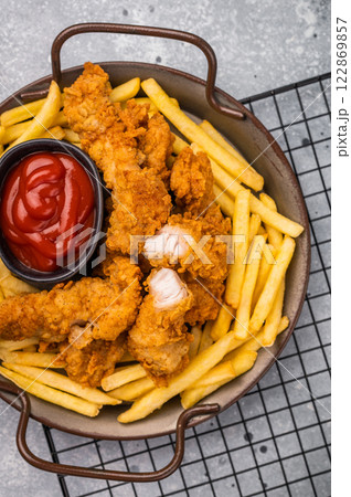 Deep fried chicken strips, stick from breast fillet. grey background. top view 122869857