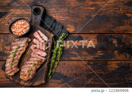 Grilled Tri Tip Steak from Black Angus beef meat. wooden background. top view 122869906