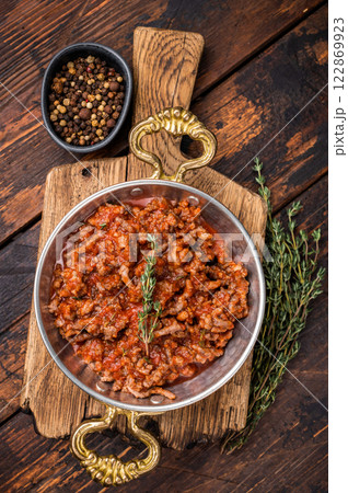 Bolognese Sauce, Authentic Italian meat and tomato pasta recipe. wooden background. top view Bolognese Sauce, Authentic Italian meat and tomato pasta recipe. wooden background. top view 122869923