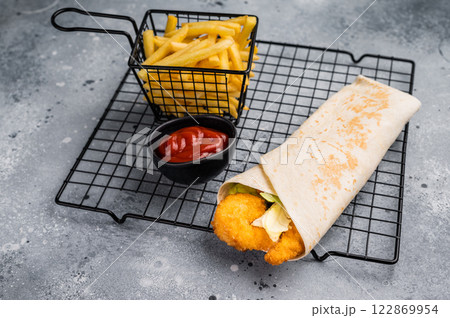 Seafood Doner kebab with shrimps, prawns, salad and french fry. grey background. top view Seafood Doner kebab with shrimps, prawns, salad and french fry. grey background. top view 122869954