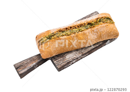 Garlic bread with herbs on wooden cutting board isolated on white background 122870293