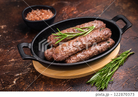 BBQ roast Turkish Urfa kebab with herbs. brown background. top view 122870373