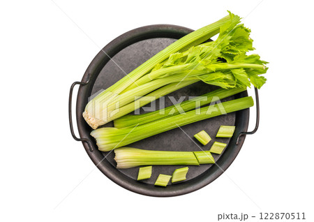 Sliced uncooked celery sticks in steel tray isolated on white background, top view 122870511