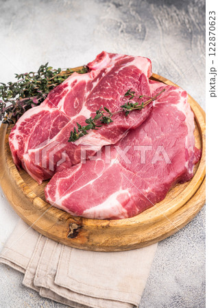 Raw pork tender neck steak, fresh meat. grey background. top view 122870623