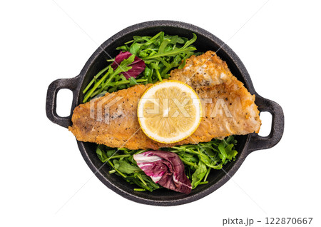 Fried Haddock fish fillet in a pan isolated on white background. top view Fried Haddock fish fillet in a pan isolated on white background. top view 122870667