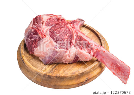 Uncooked tomahawk steak, raw black angus beef rib eye with bone on wooden board Isolated on a white background. top view 122870678