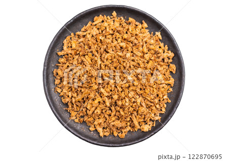 Crispy Fried dried Onion Bits isolated on white background. top view 122870695
