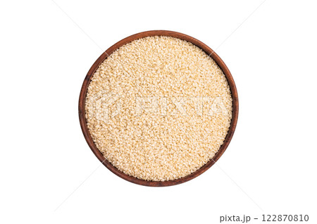 White sesame seeds in a bowl isolated on white background. top view White sesame seeds in a bowl isolated on white background. top view 122870810