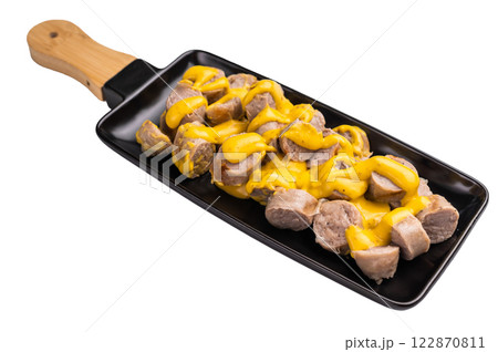 BBQ Grilled and sliced Sausages with cheese and mustard sauce in plate isolated on white background. top view BBQ Grilled and sliced Sausages with cheese and mustard sauce in plate isolated on white background. top view 122870811