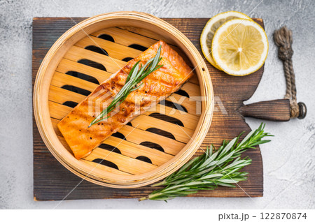 Cooked salmon fillet steak with rosemary, red sea fish. white background. top view 122870874