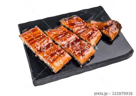 Unagi kabayaki eel, japanese grilled fish fillet with sauce isolated on white background. top view Unagi kabayaki eel, japanese grilled fish fillet with sauce isolated on white background. top view 122870916