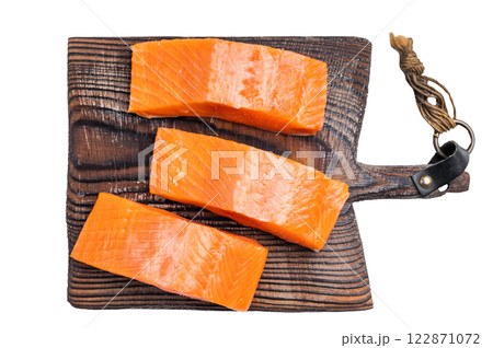 Salmon steaks, raw fish fillets on a wooden board isolated on white background. top view Salmon steaks, raw fish fillets on a wooden board isolated on white background. top view 122871072