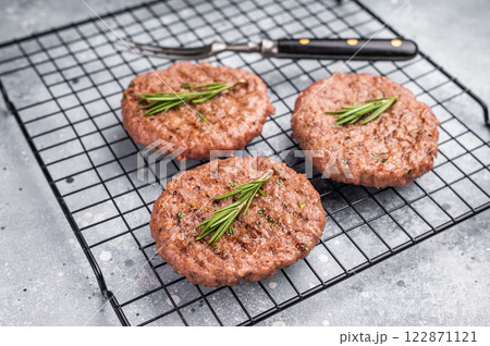 BBQ Grilled burger beef meat cutlets, chooped roast meat. grey background. top view BBQ Grilled burger beef meat cutlets, chooped roast meat. grey background. top view 122871121