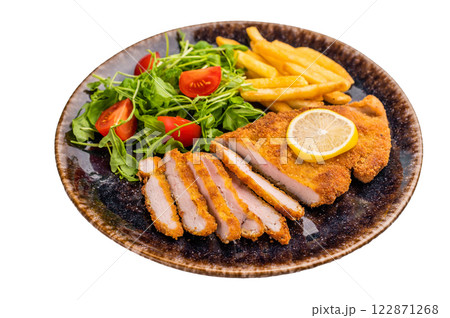 Fried Weiner schnitzel steak, pork breaded fillet meat with french fry and salad isolated on white background 122871268