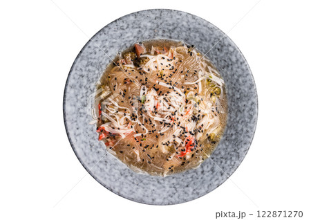 Vegan wok with glass noodles, spicy peanut dressing, fish meat and vegetables isolated on white background Vegan wok with glass noodles, spicy peanut dressing, fish meat and vegetables isolated on white background 122871270