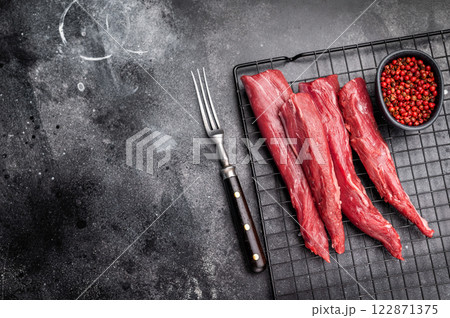 Raw lamb tenderloin fillet meat, fresh mutton. black background. top view 122871375