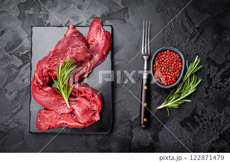 Raw Beef Machete Steak, also name Skirt steak, fresh marble meat. black background. top view Raw Beef Machete Steak, also name Skirt steak, fresh marble meat. black background. top view 122871479