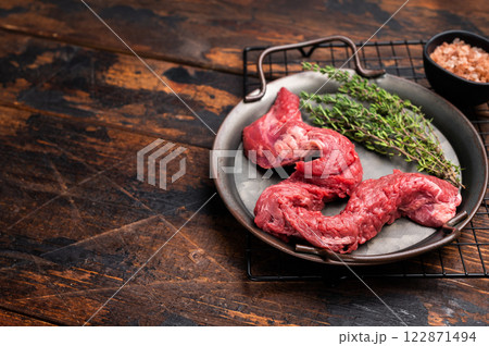 Raw Beef Machete Skirt Steak, fresh marble meat with herbs. wooden background. top view 122871494