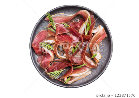 Meat appetizer dried duck breast fillet meat slices, magret smoked poultry isolated on white background. top view 122871570