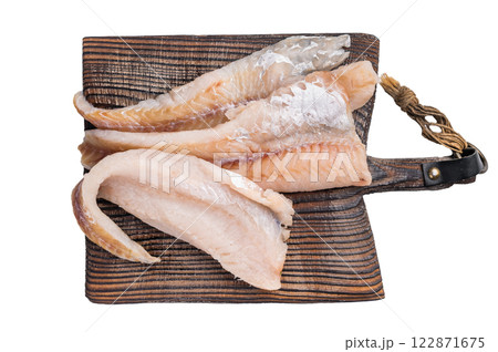 fresh Raw Pollock fish fillets on a wooden board with herbs isolated on white background. top view 122871675