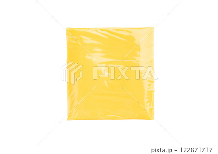 Square Slices of processed Cheddar cheese in individual plastic packaging isolated on white background 122871717