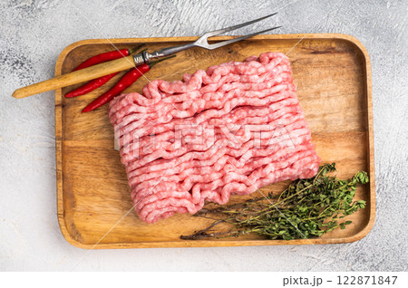 Uncooked mince veal and pork meat, raw forcemeat. white background. top view 122871847