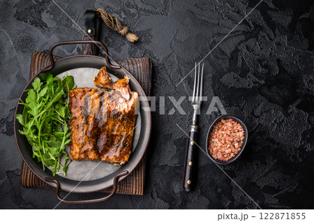 Roasted Teriyaki salmon fillet with salad. black background. top view Roasted Teriyaki salmon fillet with salad. black background. top view 122871855