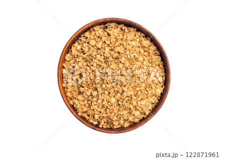 Healthy buckwheat flakes in a bowl isolated on white background. top view 122871961