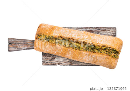 Garlic bread with herbs on wooden cutting board isolated on white background 122871963