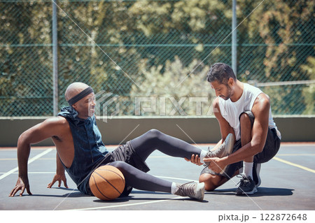 Injury, physiotherapist and basketball player with help support during sports game, first aid help on court and emergency during training. Athlete with muscle pain and medical coach after accident Injury, physiotherapist and basketball player with help support during sports game, first aid help on court and emergency during training. Athlete with muscle pain and medical coach after accident 122872648